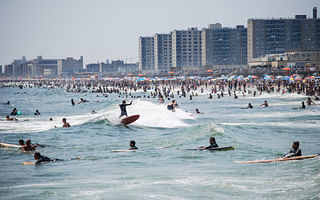 What are some affordable cities for surfing lessons?