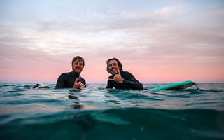 What are the key factors to consider when choosing a surfing destination?